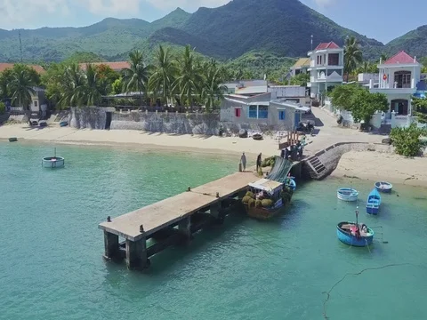 Distant Drone View People Work on Pier by Palm Sand Beach Stock Footage