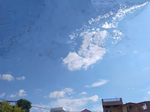 A distant elegant camera click of white clouds in the blue sky Stock Photos