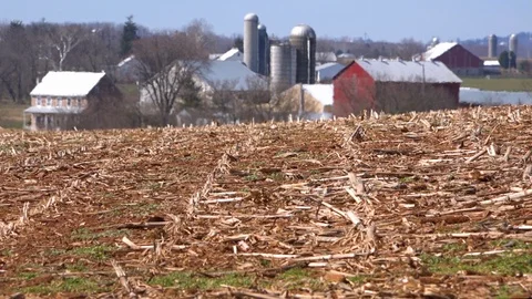 A distant farm basks in the heat of drought as American farmers cope with lack Stock Footage
