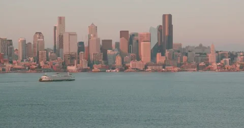 Distant ferry nearing Seattle skyline at dusk Video stock 137498306
