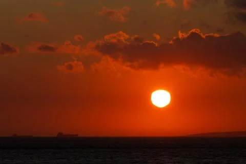 Distant Ferry at Sunset Stock Photos