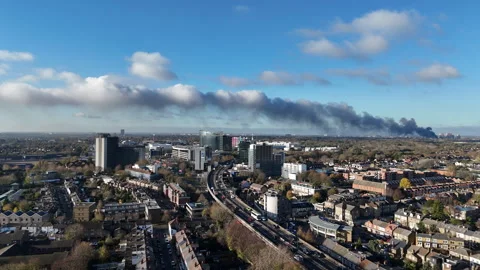 Distant fire smoke visible over Hounslow, London Stock Footage 323681035