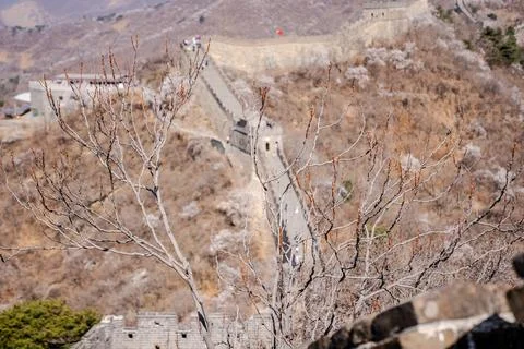 Distant Great Wall section across dry mountain valley Stock Photos