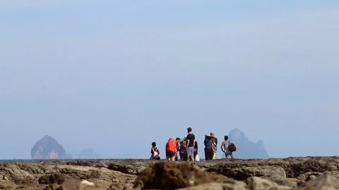 Distant Group Of People Waits For The Boat On The Beach (2) Stock Footage 86255488
