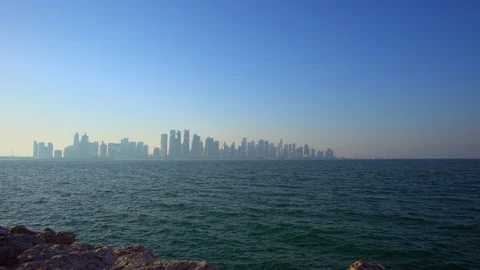 Distant, hazy skyline of Doha, Qatar, with highrise architecture Vidéo 99791610