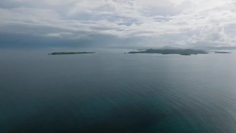 Distant islands across calm blue sea. Siargao, Philippines. Stock Footage 321909807