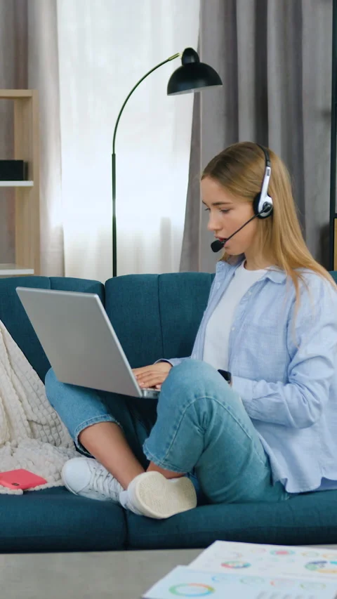 Distant learning concept where good-looking smart cheerful light haired girl in  Stock Footage 331438655