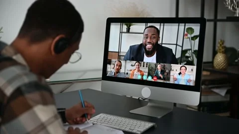 Distant learning, online education. View over a guy's shoulder, a computer Stock Footage 166977052