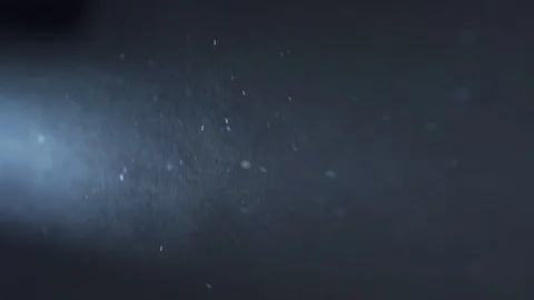 Distant light catches a dust and fog particle flow 库存影片 129639941