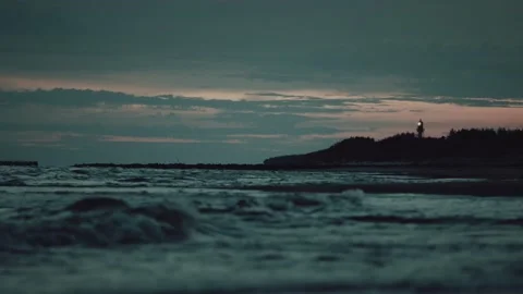 Distant Lighthouse, Evening, Waves, Dark Blue Sea (version 1/3) Stock Footage 205274475