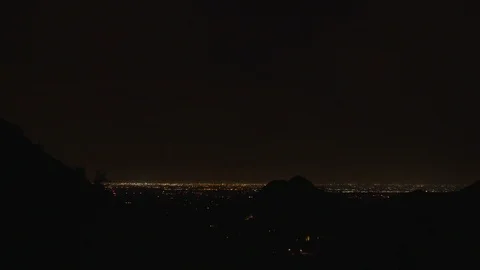 Distant Lightning over Desert City at Night Stock Footage 97213881