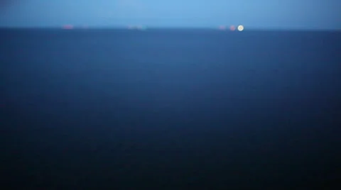 Distant Lights On Ocean Surface Stock Footage 26201128