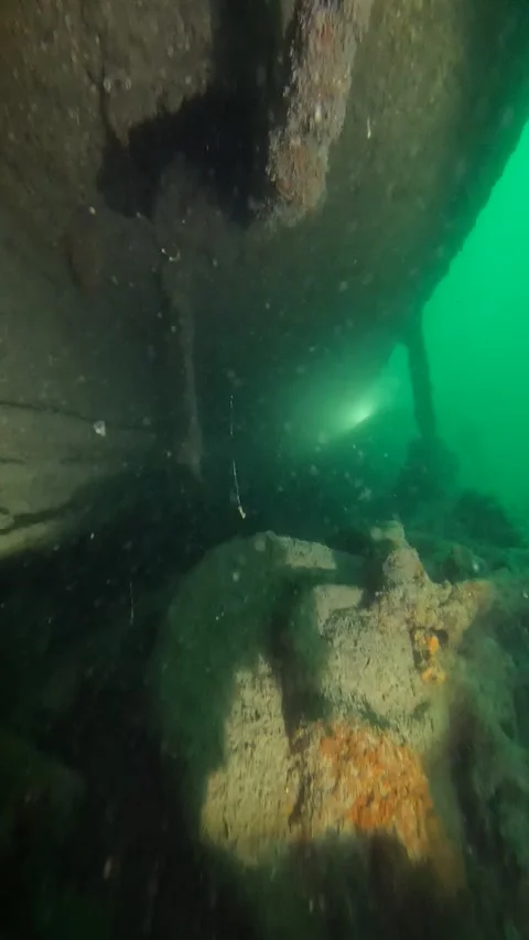 Distant lights seen through underwater wreckage Stock Footage 277227745