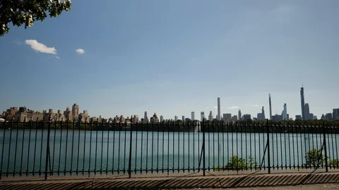 Distant Manhattan Buildings seen from Central Park Reservoir Stock Footage 115012254