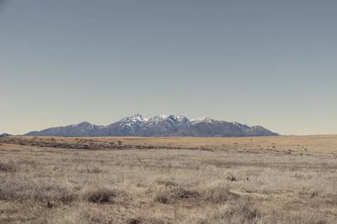 Distant mountain range with hills covered in grass in the 库存照片