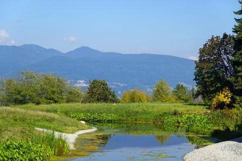 Distant mountain range under bright blue sky Stock Photos