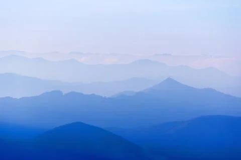 Distant mountain silhouettes Stock Photos