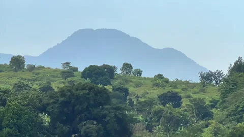 Distant mountain view with lush green hills 動画素材 339532353