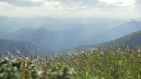 Distant mountains in the sunlight. A light breeze, a view and a large space Stock Footage 230263471