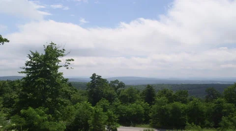Distant Mountaintop View on Cloudy Summer Day Vídeo Stock 65963843