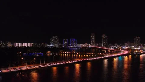 Distant night panoramic view from sea of Miami, Florida, USA, snaking road of Stock-Footage 275285131
