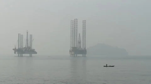 Distant Ocean Oil Drilling Platform And  Ships Stock Footage 261948218