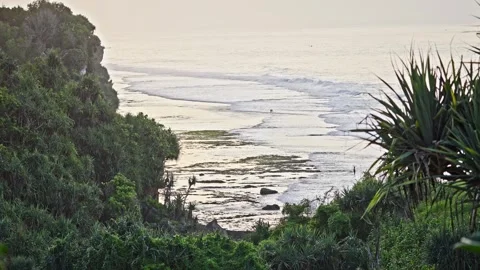 Distant Ocean Waves in the Early Morning Light Over Calm Sea Stock Footage 296570739