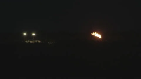Distant Oil Rig Flare at Night Stock Footage