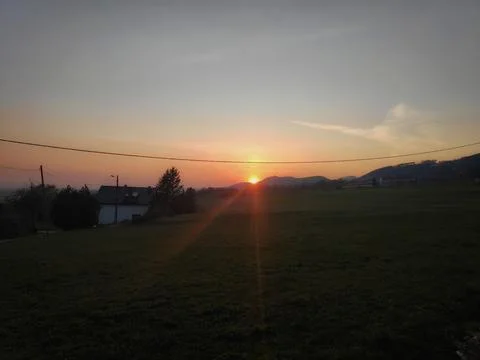 Distant Orange Sun in the Dark Fotos Stock