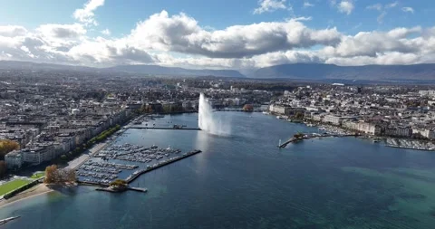 Distant orbit by drone in the Geneva bay with the Jet d'Eau Stock Footage 234315681