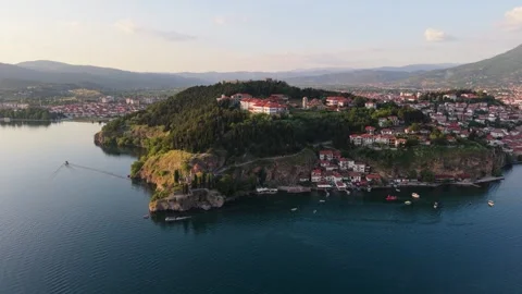 Distant Orbiting Drone View Of Kaneo Church And Ohrid Old Town 動画素材 338607484