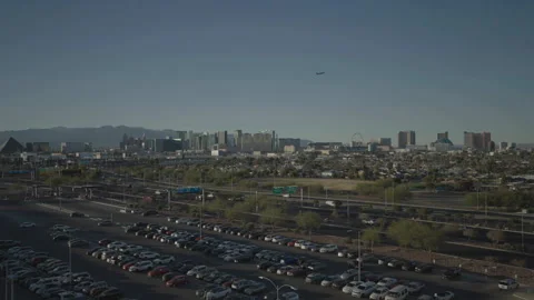Distant overall parking foreground, highway middle, Vegas background 스톡 동영상 336671883