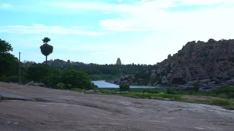 Distant panorama of hill, temple and lush green vegetation. Stock Footage 105285686
