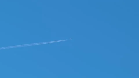 Distant passenger jet plane flying on hi... | Stock Video | Pond5
