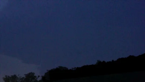 Distant Pink Lightning Forks in Dark Sky Stock Footage 112682032