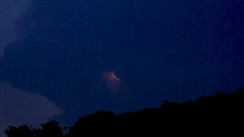 Distant Pink Lightning Forks in Dark Sky Stock Footage 112682409