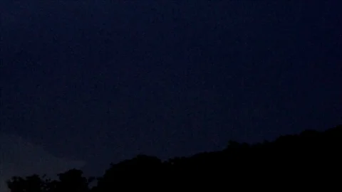 Distant Pink Lightning Forks in Dark Sky Stock Footage 112694383