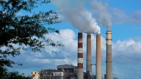 Distant Power Plant Smokestacks Video stock 116571626