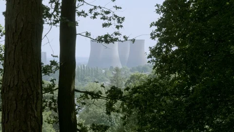 Distant powerplant steam stacks Stock Footage 112963431