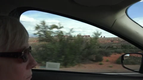 Distant rock destination, DRIVING, ARCHES NATIONAL PARK Stock Footage 63380594