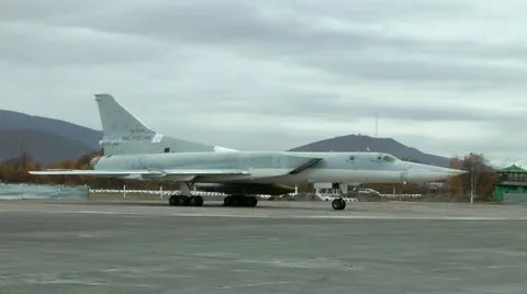 Distant rocket carrier-bomber of TU-22M3 Backfire. The plane on parking Stockbeeldmateriaal 12725322