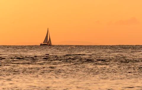 Distant Sailing Ship at Dawn Foto stock