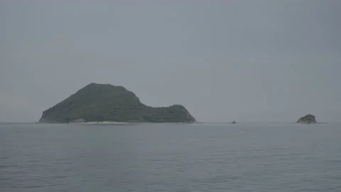 Distant scenic view of the turtle-shaped island of Marathonissi Stock Footage 238772184