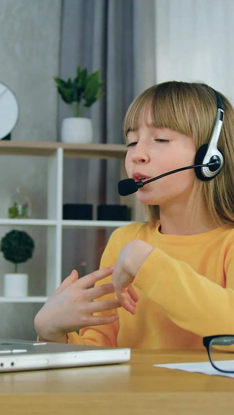 Distant school education concept where cute excited primary schoolgirl wearing h Stock Footage 332732046