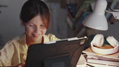 Distant School Learning Concept. Girl Uses Tablet Computer Stock Footage 252969702