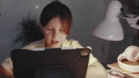 Distant School Learning Concept. Girl Uses Tablet Computer Stock Footage 255786262