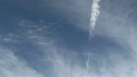 Distant Shot Of Commercial Plane Flying Cloudy Sky Stock Footage 70820560