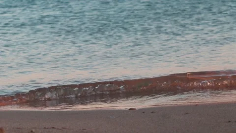 A distant shot of sea waves with a background of blue sky Stock Footage 250963946