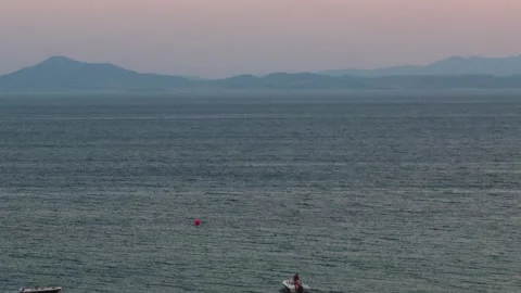 A distant shot of sea waves with a background of blue sky Stock Footage 250964535