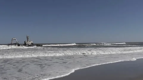 Distant shot of a shipwreck of a trawler just off the Skeleton Coast, Namibia Stock-Footage 274651298